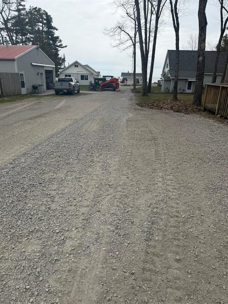 Fresh gravel lane graded between cottages